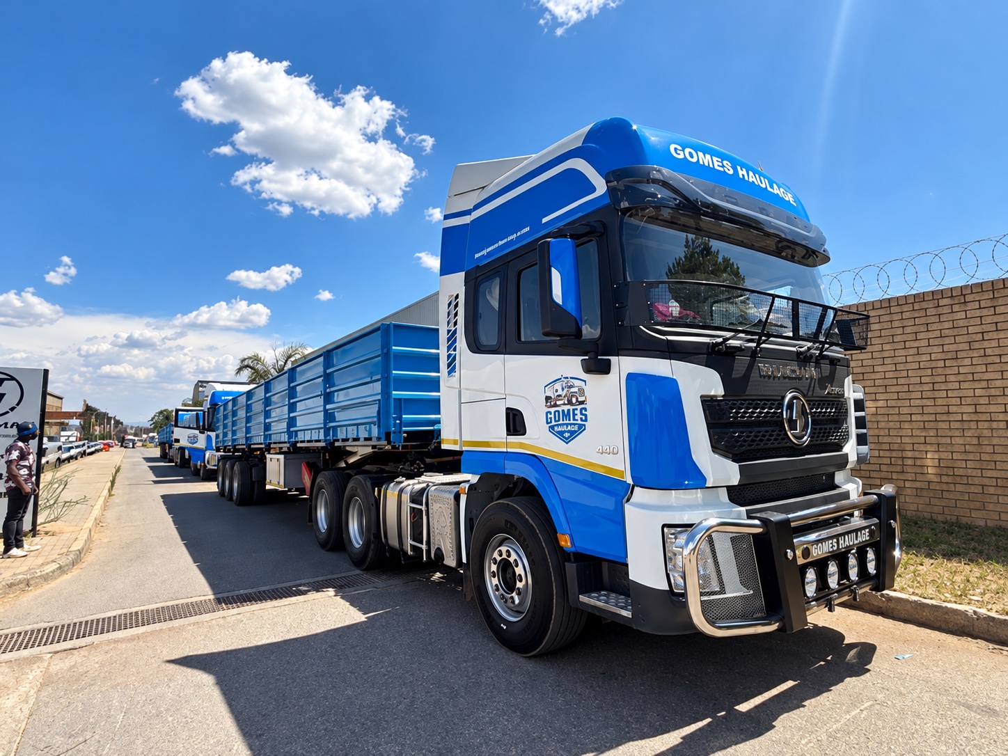 A blue and white haulage truck